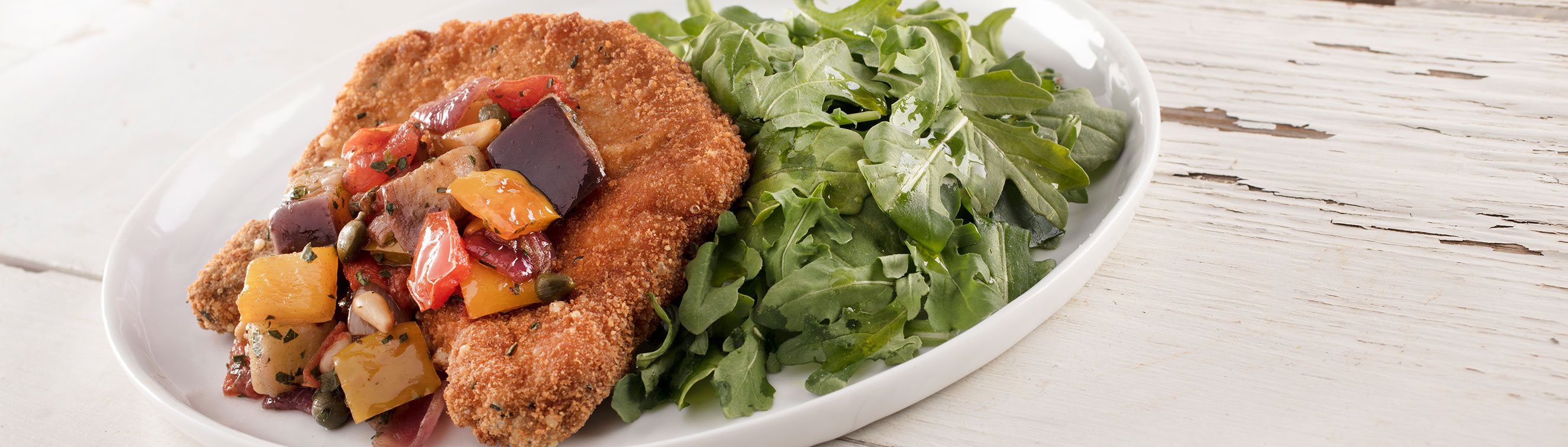 Breaded Butterflied Pork Chop with Eggplant Caponata Sicilliana on Arugula - Love of Food